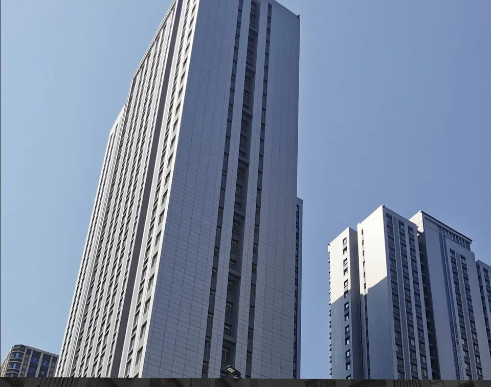 High-rise clad in fibre cement curtain wall panels